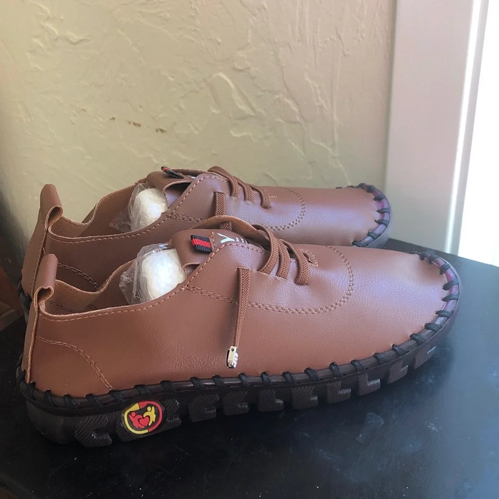 OY soft light brown leather like material size 36